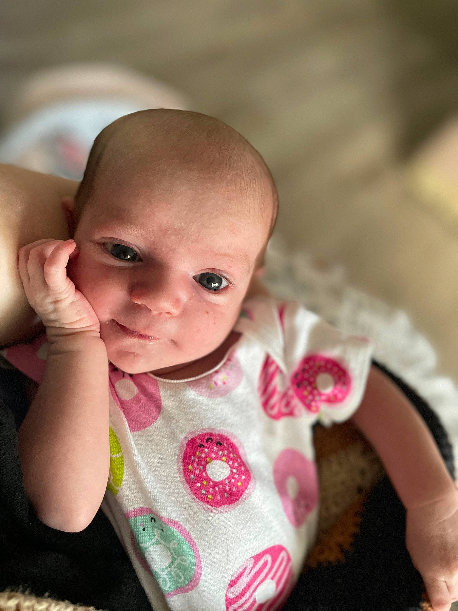 Iona is registered to the contest to win money with this photo: arm, baby, baby_toddler_clothing, cheek, chin, eyebrow, eyelash, facial_expression, finger, gesture, hand, happy, head, iris, lip, mouth, nose, person, pink, skin