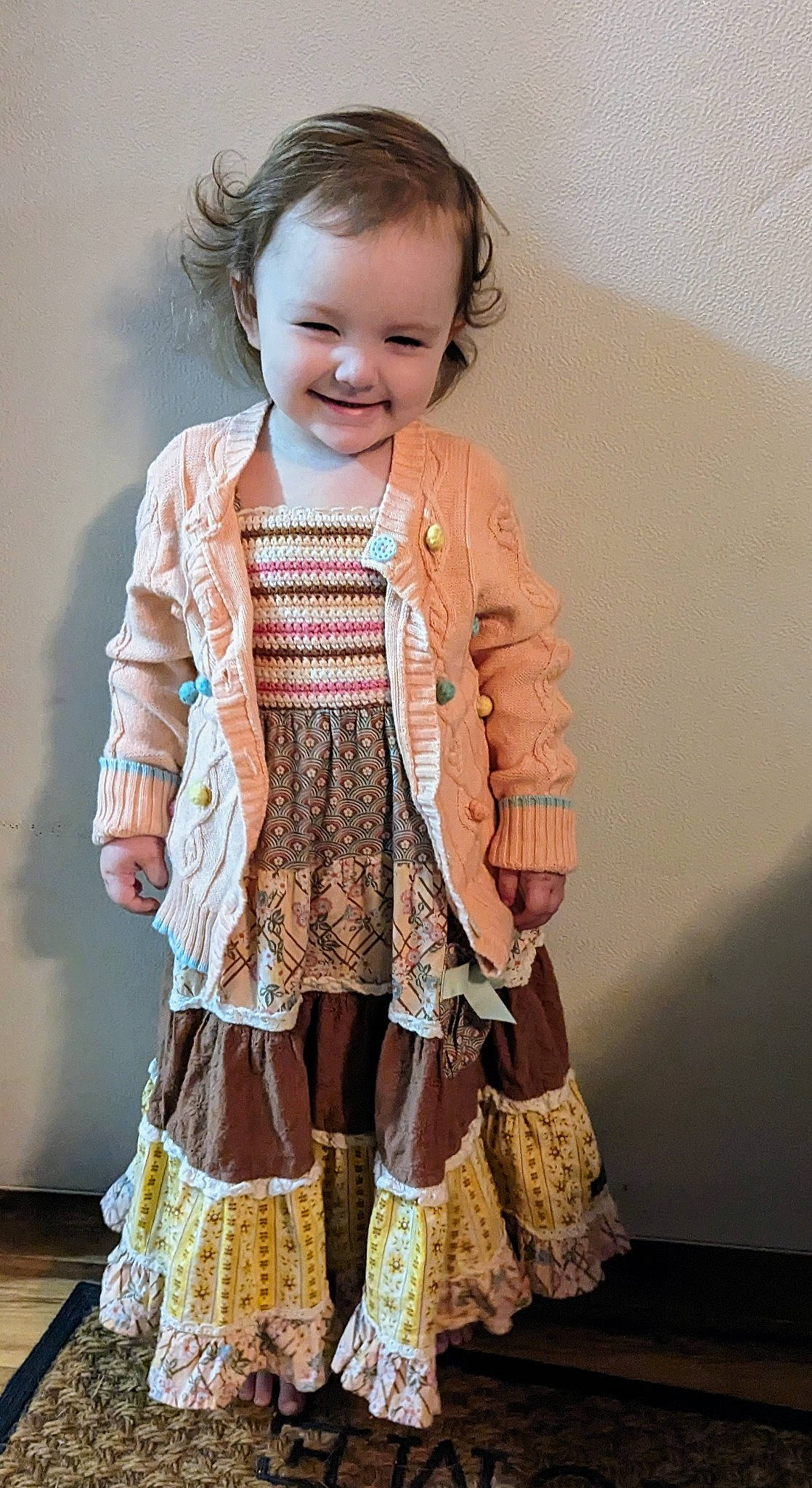 Georgia joined the competition — help win amazing prizes! baby_toddler_clothing, child, dress, embellishment, face, fashion_design, head, human_body, joint, joy, neck, one_piece_garment, outerwear, pattern, person, shoulder, skin, sleeve, smile, toddler