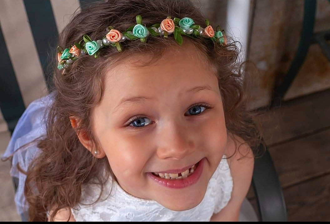 Lacie is registered to the contest to win money with this photo: chin, dress, eye, eyebrow, eyelash, flash_photography, fun, hair, hair_accessory, hairstyle, happy, head, headgear, headpiece, iris, jewellery, joy, neck, person, plant