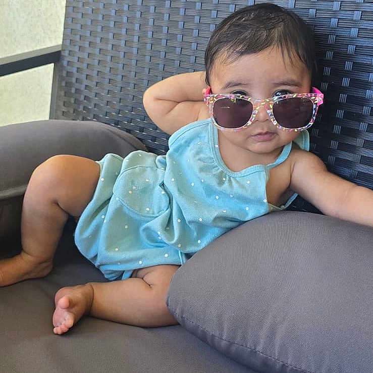 Sadhana joined the competition — help win amazing prizes! baby, blue_clothing, chair, child, cushion, cute, expression, fashion, foot, hand, infant, outdoor, person, polka_dot, relaxed, seat, shade, skin, summer, sunglasses