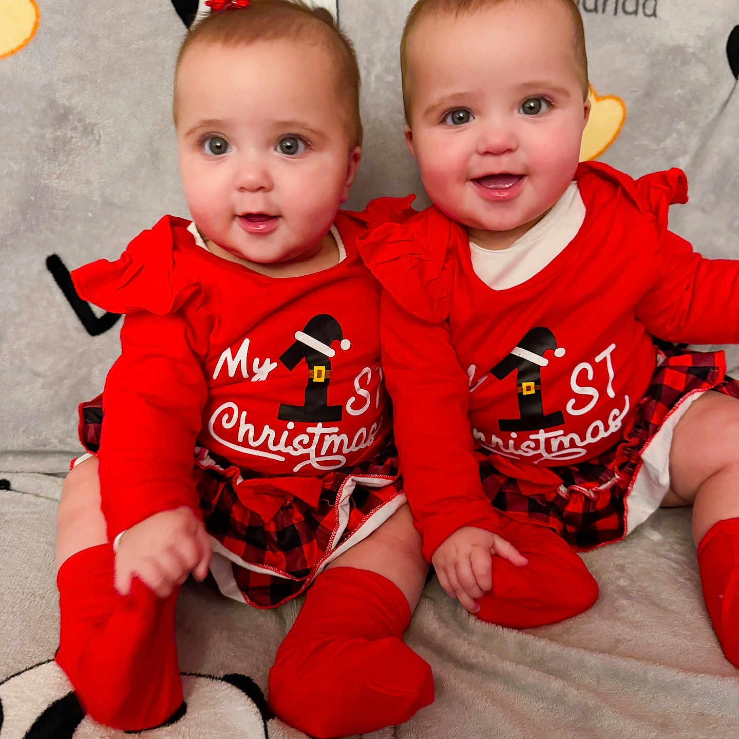 Scarlet E Violet joined the competition — help win amazing prizes! baby, blanket, bow, child, christmas, cozy, cute, face, happy, holiday, indoor, infant, matching_outfits, panda, plaid_skirt, portrait, red_clothing, sitting, smiling, toddler