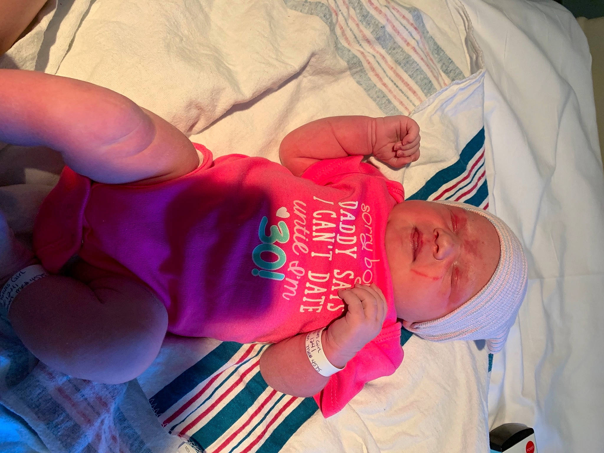 Amaya is registered to the contest to win money with this photo: baby, baby_products, baby_sleeping, baby_toddler_clothing, child, comfort, elbow, event, happy, hat, head, headwear, human_body, linens, nail, person, room, sleeve, t_shirt, thumb