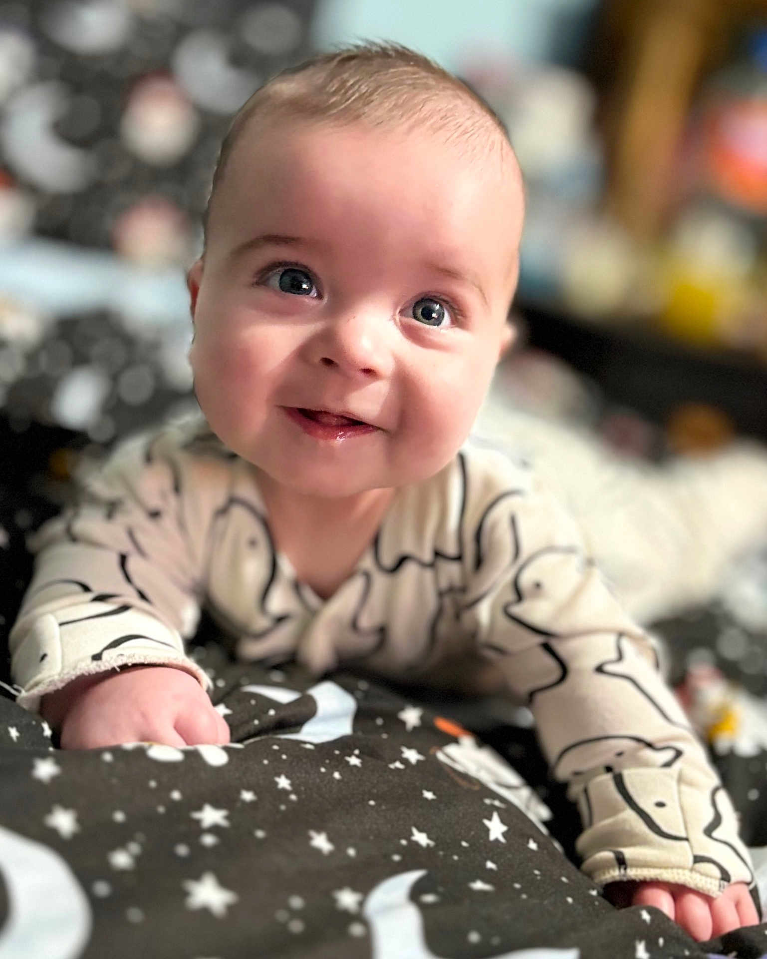 Brodiejesse joined the competition — help win amazing prizes! baby, blanket, child, closeup, cozy, crawling, cute, face, happy, indoors, infant, moon, pajamas, pattern, portrait, sleepwear, smiling, soft, stars, young
