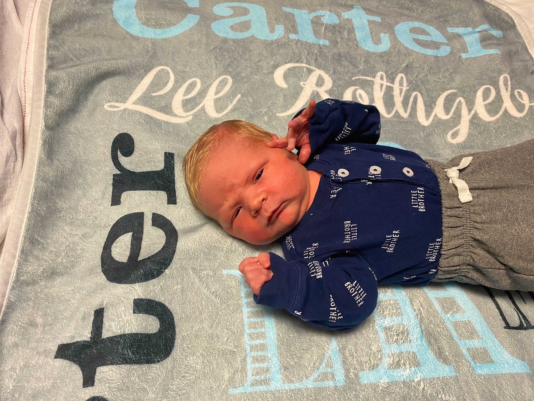 Carter joined the competition — help win amazing prizes! baby, baby_products, baby_toddler_clothing, bedding, bedtime, child, comfort, flooring, font, grey, happy, linens, pattern, person, product, room, sitting, sleep, sleeve, textile