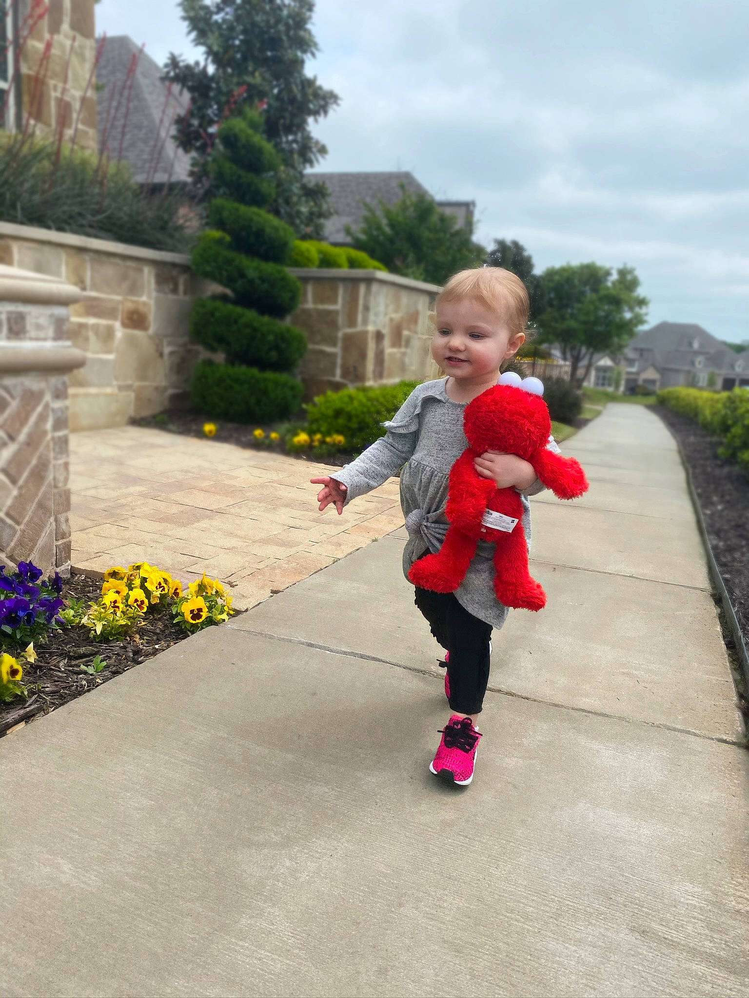 Harleigh is registered to the contest to win money with this photo: child, flower, footwear, fun, garden, leisure, person, pink, plant, play, recreation, red, running, shoe, toddler, vacation, walking