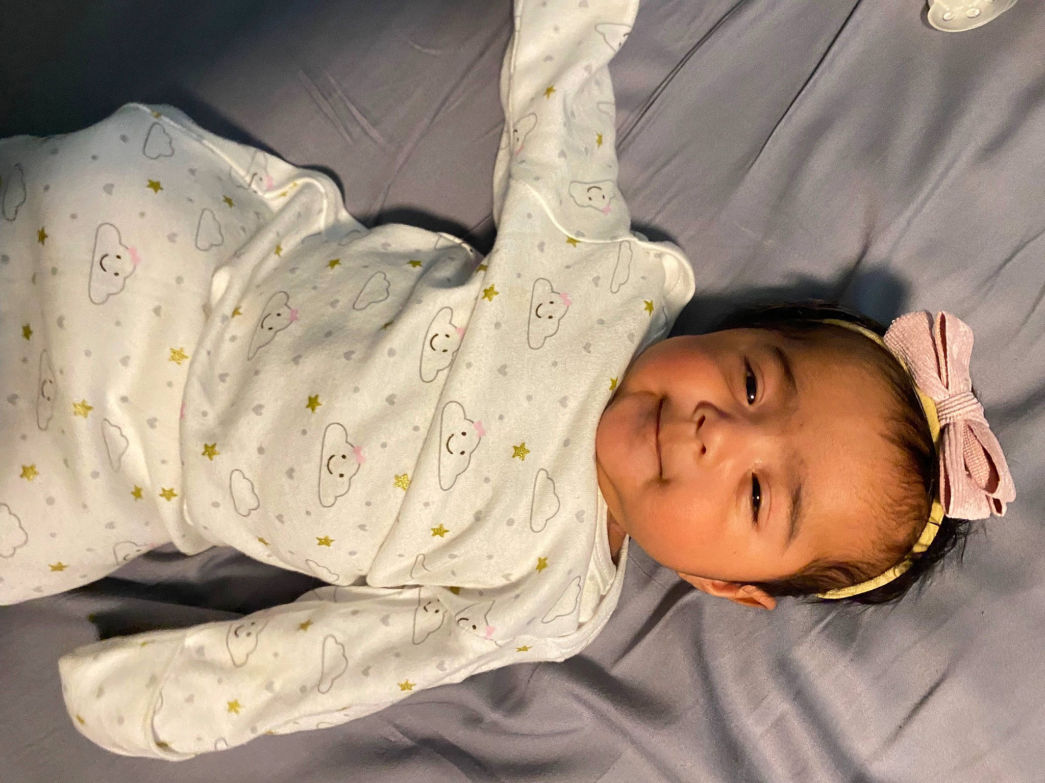 Camila is registered to the contest to win money with this photo: baby, baby_products, baby_toddler_clothing, cheek, child, comfort, finger, hand, happy, hat, human_body, human_leg, linens, nose, person, plant, skin, sleeve, smile, toddler