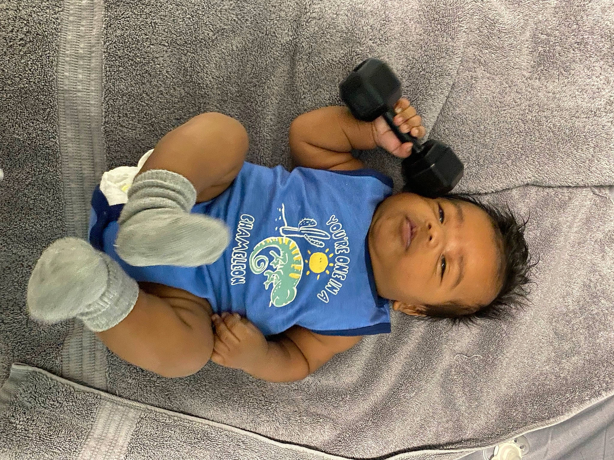 Cesar is registered to the contest to win money with this photo: abdomen, baby_toddler_clothing, baseball_cap, black_hair, cap, comfort, elbow, hat, human_leg, joint, knee, mammal, person, shorts, sleeve, sportswear, t_shirt, textile, thigh, toddler