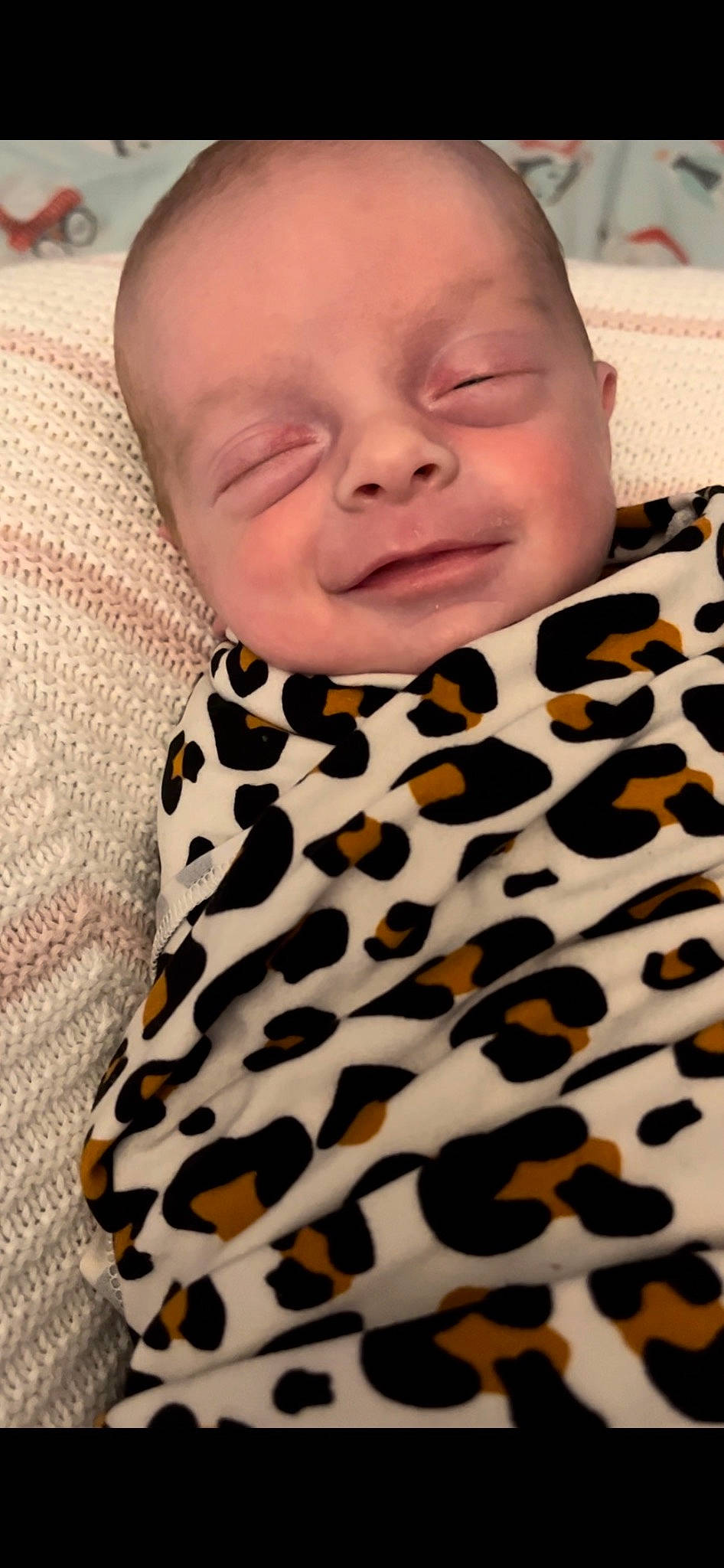 Bliss is registered to the contest to win money with this photo: baby, baby_laughing, baby_toddler_clothing, child, collar, comfort, face, facial_expression, happy, linens, outerwear, pattern, person, photograph, portrait_photography, skin, sleeve, smile, textile, toddler