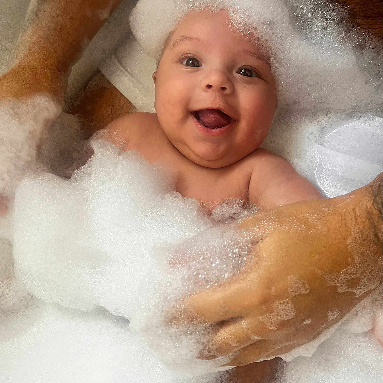 Rio is registered to the contest to win money with this photo: baby, babylaughing, bathing, bathtub, bodypart, bubble, face, finger, hand, happy, head, laughing, leisureactivities, newborn, person, photography, portrait, smile, tub, washing
