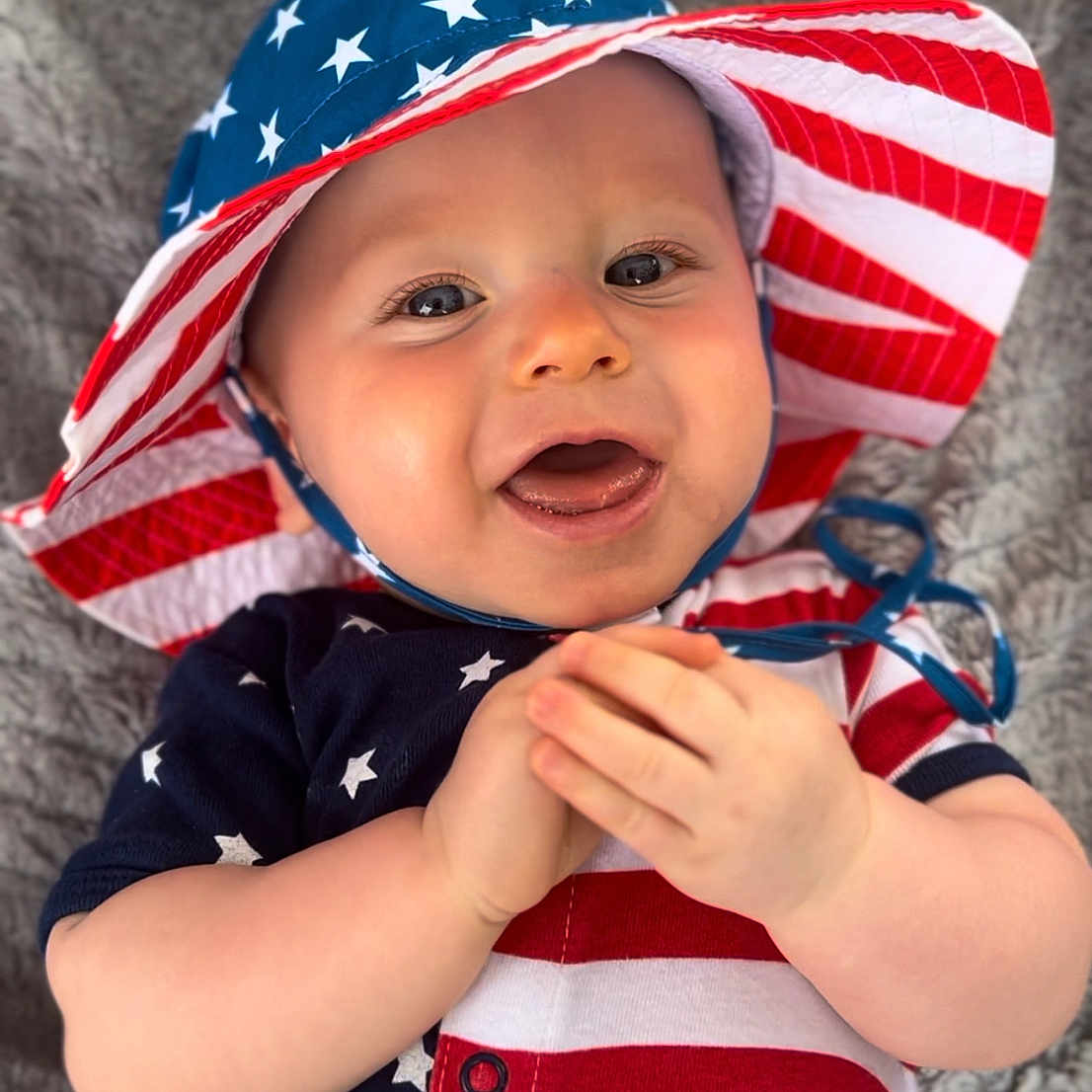 Brayden joined the competition — help win amazing prizes! americanflag, baby, bodypart, bonnet, cap, clothing, dress, face, finger, flag, hand, happy, hat, head, person, photography, portrait, smile, sunhat, t_shirt