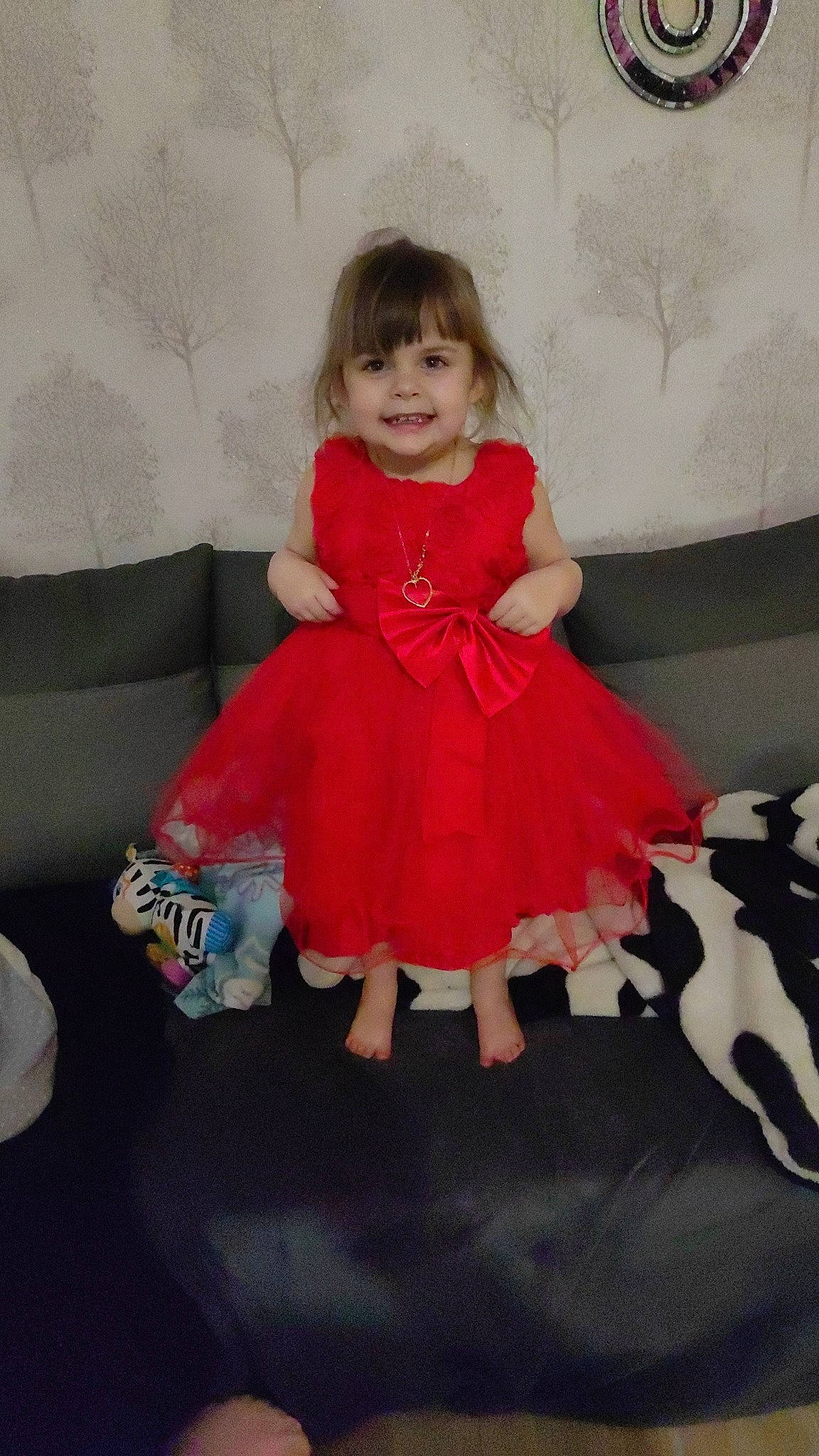 Jennah participe au concours pour gagner de l'argent avec cette photo : baby_toddler_clothing, child, day_dress, dress, embellishment, event, fashion_design, flooring, formal_wear, fun, happy, joy, magenta, one_piece_garment, pattern, person, pink, ruffle, sitting, sleeve