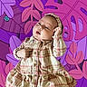 Talitha joined the competition — help win amazing prizes! baby, child, plaid_dress, headband, portrait, cute, indoor, infant, person, pink, purple, background, pattern, leaves, cartoon, clothing, smiling, face, hands, expression