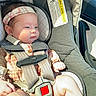 baby, car_interior, car_seat, child, cute, eyes, fabric, face, fingers, hands, headband, infant, mouth, plaid_clothing, portrait, safety, seat, seatbelt, sunlight, young_child