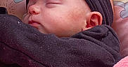 Aubree joined the competition — help win amazing prizes! baby, black_clothing, blanket, child, closeup, cozy, cute, ear, face, headband, indoor, infant, peaceful, pillow, pink, portrait, resting, sleeping, soft_texture, toddler