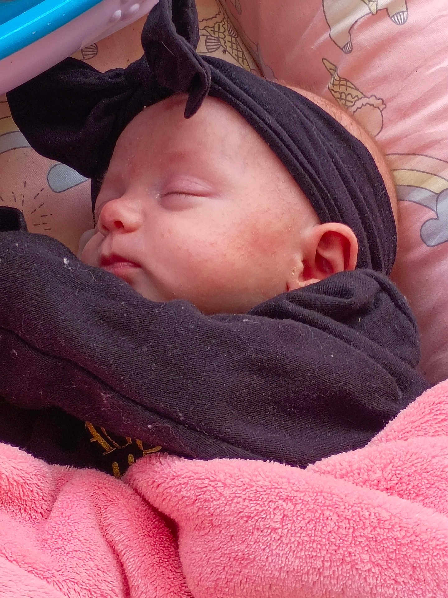 Aubree joined the competition — help win amazing prizes! baby, sleeping, blanket, headband, pink, black_clothing, face, ear, pillow, soft_texture, infant, peaceful, resting, cute, child, cozy, indoor, closeup, portrait, toddler