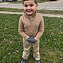Christopher joined the competition — help win amazing prizes! child, boy, smiling, grass, gloves, sweater, pants, shoes, outdoor, suburban, street, house, car, sidewalk, cool_weather, happy, portrait, standing, casual_clothing, daytime