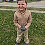 Christopher joined the competition — help win amazing prizes! child, boy, smiling, grass, outdoor, sweater, pants, gloves, shoes, sidewalk, trees, residential, neighborhood, house, car, winter, casual_clothing, portrait, standing, happy