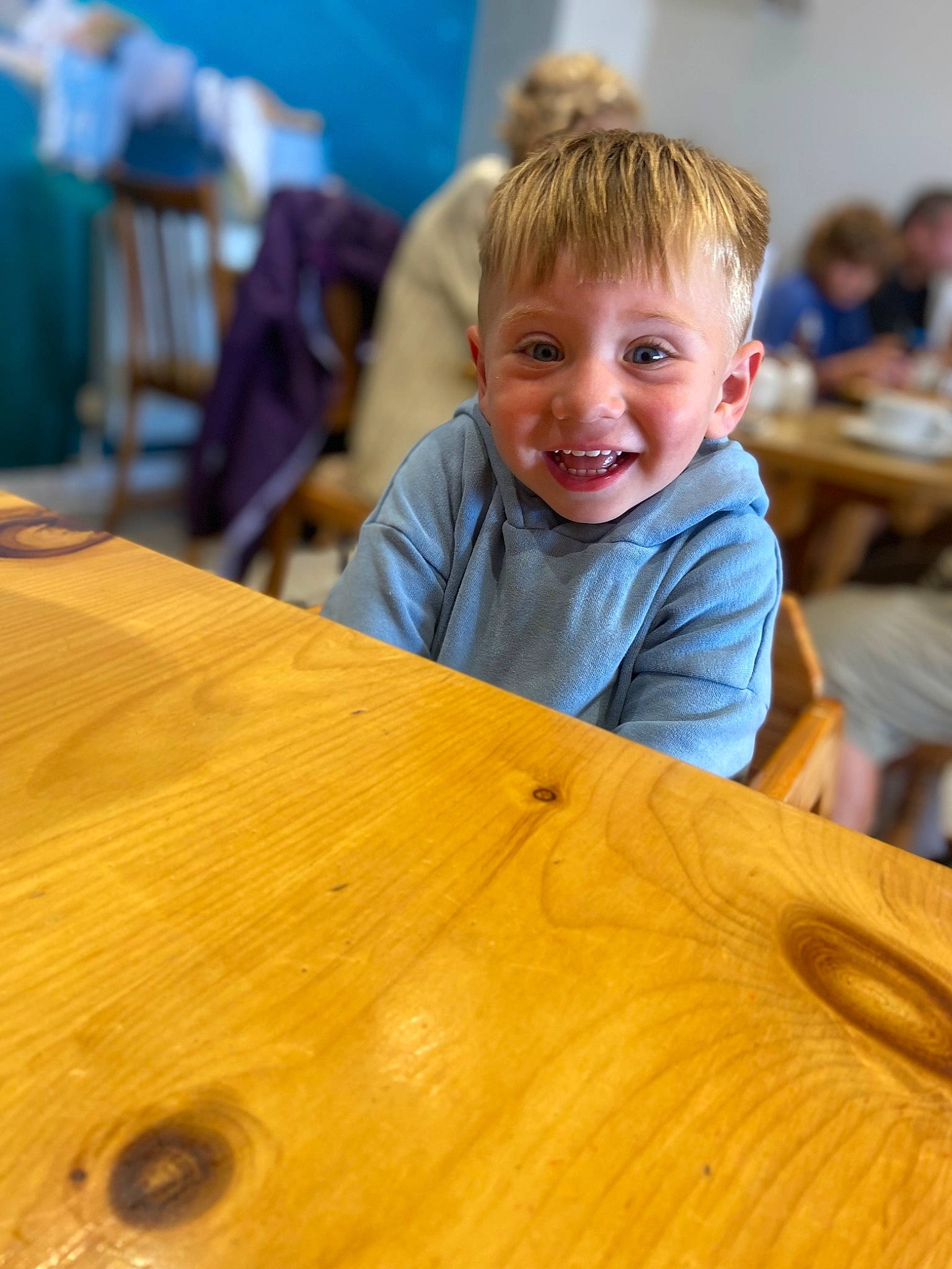 Billy joined the competition — help win amazing prizes! bench, chair, desk, event, flooring, fun, furniture, happy, hardwood, joy, leisure, lumber, person, plank, plywood, sitting, smile, table, toddler, varnish