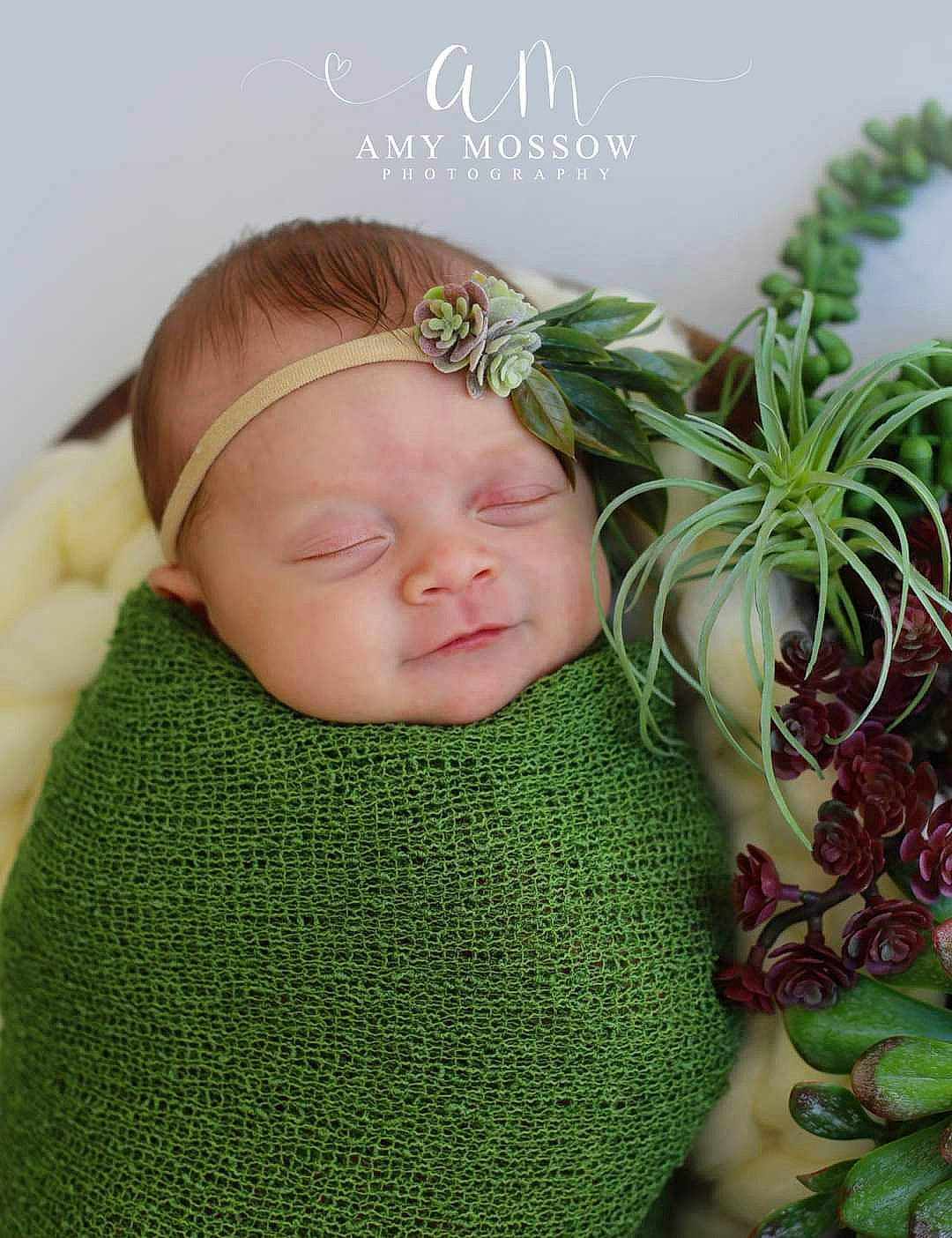 Gianna joined the competition — help win amazing prizes! baby, baby_toddler_clothing, child, evergreen, fashion_accessory, flowerpot, grass, happy, headgear, headpiece, herb, leaf_vegetable, linens, pattern, person, plant, sleeve, smile, terrestrial_plant, textile