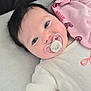 Justine a rejoint le concours — aidez-le/la à gagner de superbes lots ! baby, infant, pacifier, blanket, pink, onesie, smiling, face, eyes, hair, closeup, cute, newborn, cozy, soft, lying_down, bed, cheek, portrait, child