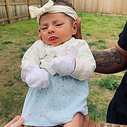 Estella joined the competition — help win amazing prizes! arm, baby, backyard, bodypart, clothing, face, fence, grass, hat, head, nature, outdoors, people, person, photography, plant, portrait, skin, tattoo, yard