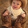 baby, bandana, bokeh, clothing, cowboy_boots, cowboy_hat, cute, eyes, footwear, hands, hat, infant, outdoor, portrait, rustic, shallow_depth_of_field, sitting, smile, warm_tones, wooden_bucket