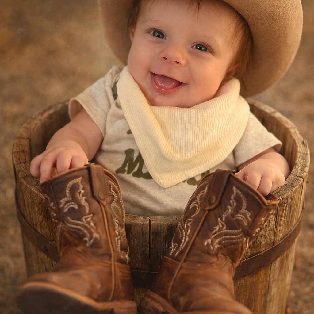 Noah Steven joined the competition — help win amazing prizes! baby, bandana, bokeh, clothing, cowboy_boots, cowboy_hat, cute, eyes, footwear, hands, hat, infant, outdoor, portrait, rustic, shallow_depth_of_field, sitting, smile, warm_tones, wooden_bucket