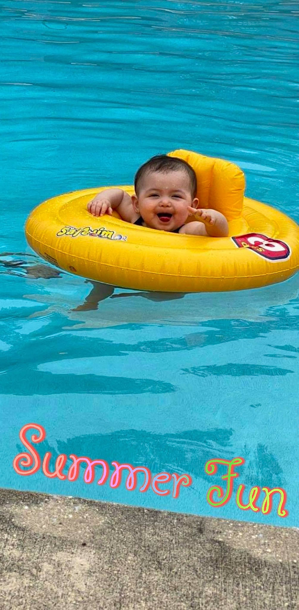 Trinity is registered to the contest to win money with this photo: baby, baby_float, baby_products, boats_and_boating_equipment_and_supplies, fun, games, happy, inflatable, joy, leisure, lifejacket, nonbuilding_structure, person, personal_protective_equipment, play, recreation, smile, toddler, tubing, vacation