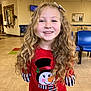 architecture, blonde, bodypart, child, clothing, costume, face, female, girl, hair, head, indoors, mouth, pants, person, photography, portrait, shirt, t_shirt, teeth