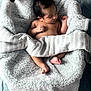 baby, bedroom, blanket, child, comfort, cozy, cute, indoor, infant, newborn, peaceful, person, plush_toy, resting, skin, sleeping, soft_texture, striped_cloth, toddler, toy