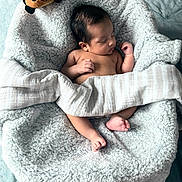 Michael is registered to the contest to win money with this photo: baby, bee, blanket, child, closeup, cozy, cute, foot, hand, indoors, infant, newborn, peaceful, plush_toy, resting, skin, sleeping, soft_texture, toddler, wrapped