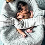 baby, bee, blanket, child, closeup, cozy, cute, foot, hand, indoors, infant, newborn, peaceful, plush_toy, resting, skin, sleeping, soft_texture, toddler, wrapped