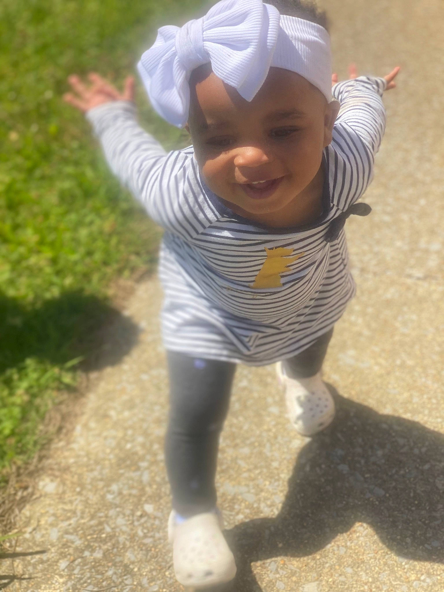 Kennedi joined the competition — help win amazing prizes! baby, baby_toddler_clothing, child, costume, fun, gesture, glove, goggles, grass, happy, headgear, headwear, people_in_nature, person, personal_protective_equipment, plant, play, sleeve, smile, soil