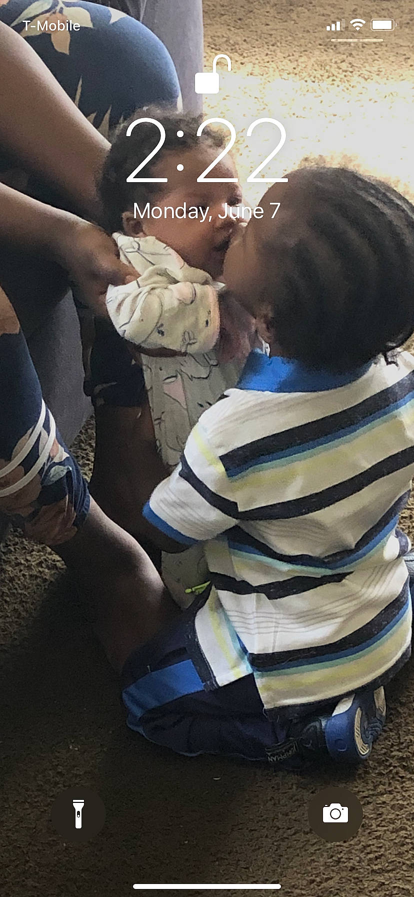 Cortez is registered to the contest to win money with this photo: bracelet, child, elbow, eyewear, font, fun, gesture, hair_coloring, happy, hug, leisure, love, person, personal_protective_equipment, recreation, romance, shoulder, sitting, t_shirt, tree