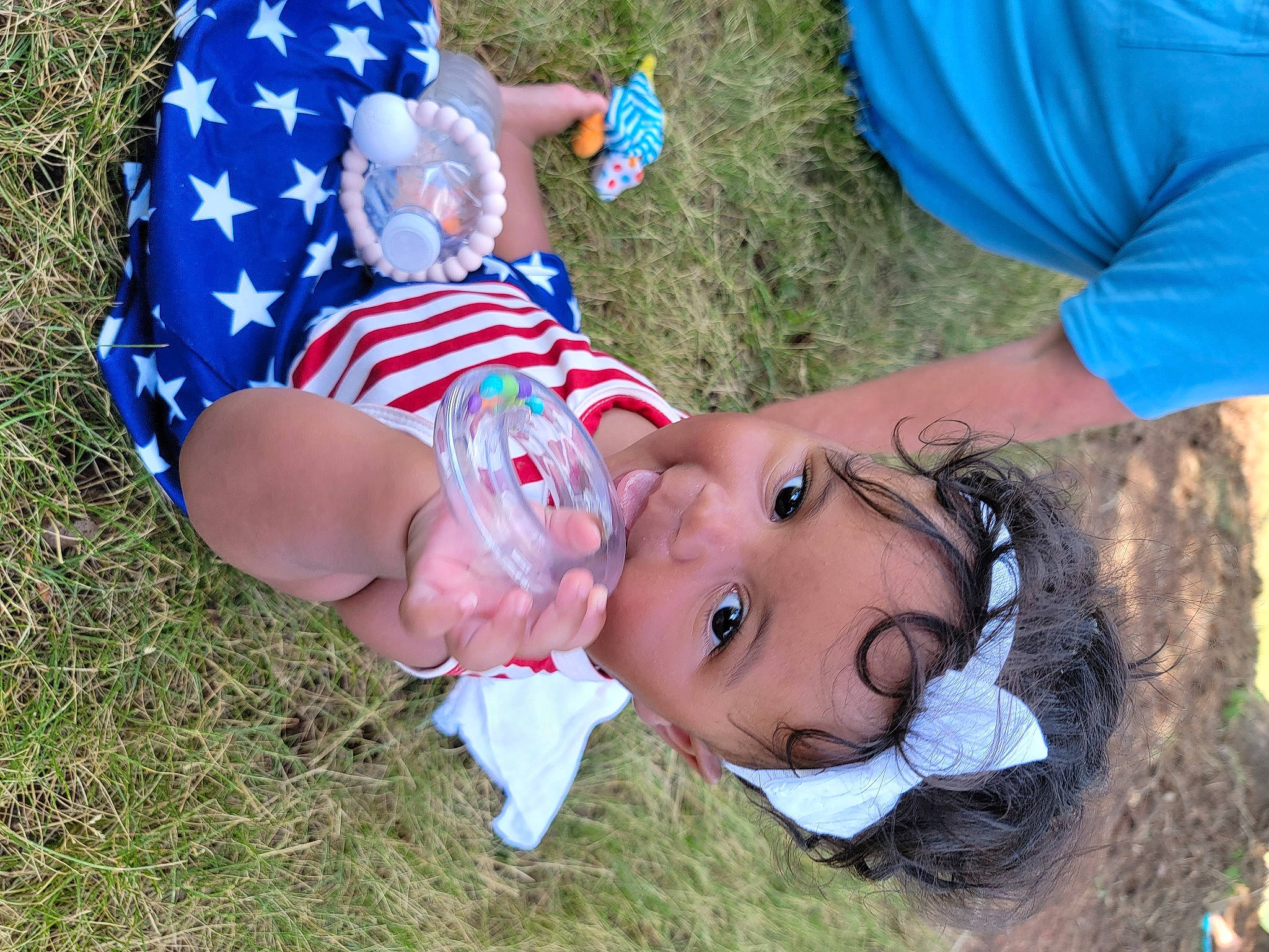 Margot joined the competition — help win amazing prizes! baby, blue, electric_blue, fun, grass, grass_family, grassland, happy, hat, headwear, lawn, leisure, meadow, natural_environment, people_in_nature, person, plant, recreation, t_shirt, toddler