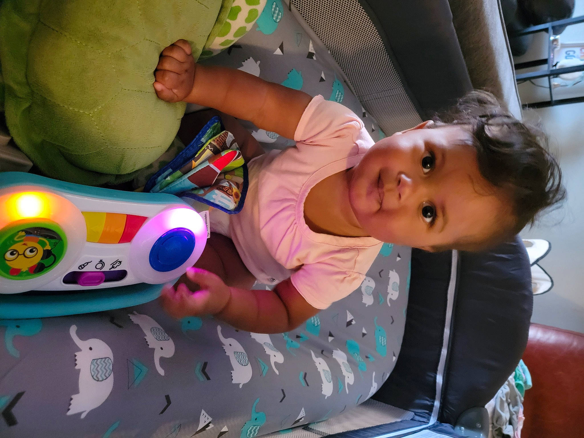 Margot is registered to the contest to win money with this photo: baby, baby_products, baby_toddler_clothing, baby_toys, beauty, child, event, facial_expression, fun, happy, leisure, mouth, organ, party, person, pink, play, sitting, smile, toddler