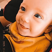 Sohan participe au concours pour gagner de l'argent avec cette photo : apparel, baby, bib, car_seat, child, closeup, clothing, cute, eyes, face, happy, head, indoors, infant, person, portrait, seatbelt, skin, smiling, young