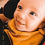 Sohan participe au concours pour gagner de l'argent avec cette photo : apparel, baby, bib, car_seat, child, closeup, clothing, cute, eyes, face, happy, head, indoors, infant, person, portrait, seatbelt, skin, smiling, young