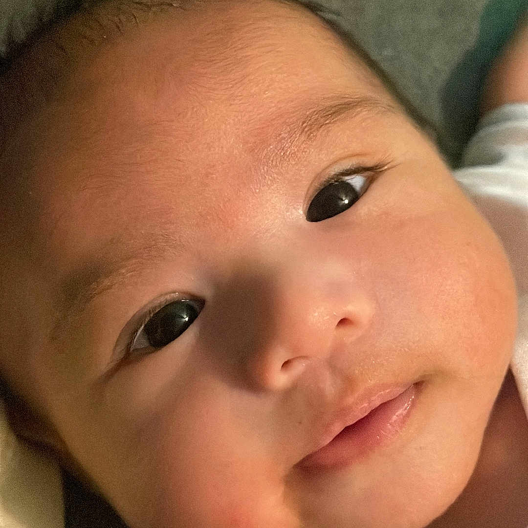 Eren Kai joined the competition — help win amazing prizes! accessories, baby, bed, bodypart, cushion, earring, face, happy, head, homedecor, jewelry, laughing, mouth, newborn, person, photography, portrait, quilt, selfie, smile