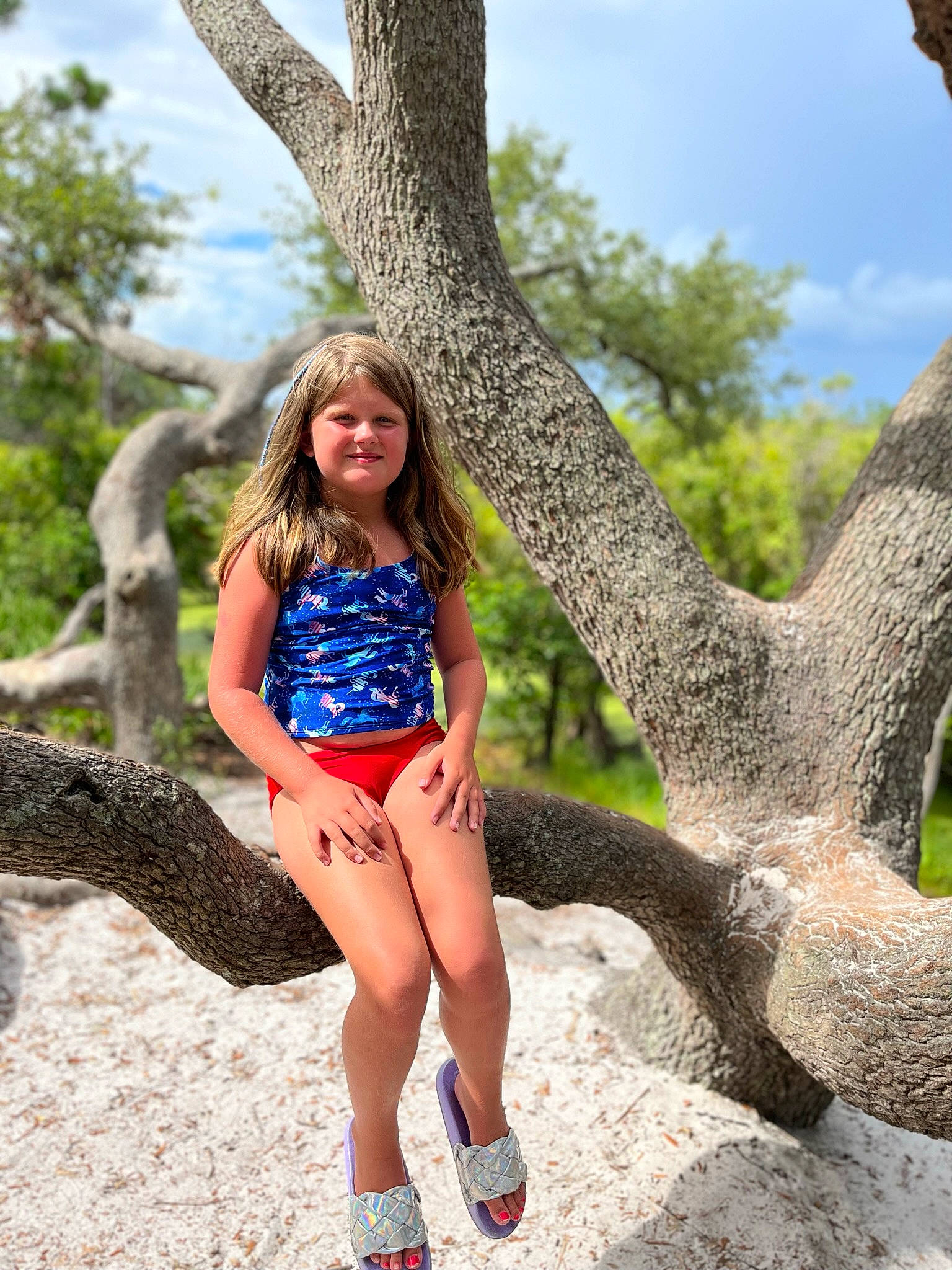 Kiley is registered to the contest to win money with this photo: cloud, electric_blue, fun, grass, happy, human_body, human_leg, joy, knee, leg, leisure, long_hair, people_in_nature, person, recreation, sky, smile, thigh, tree, trunk