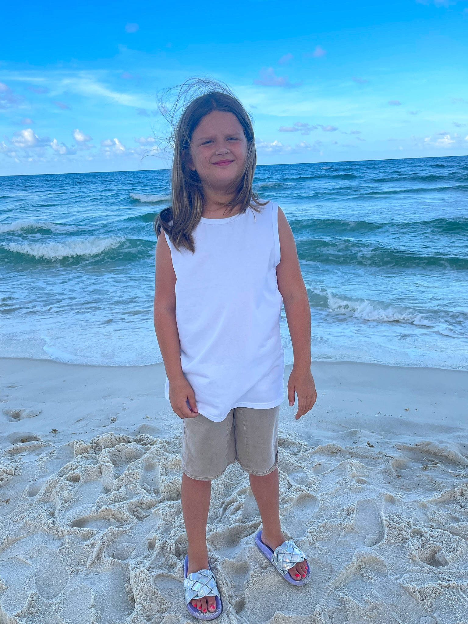 Kiley is registered to the contest to win money with this photo: aqua, azure, beach, body_of_water, cloud, electric_blue, flash_photography, fun, happy, headwear, horizon, joy, leisure, natural_environment, people_in_nature, person, sky, sleeve, smile, standing