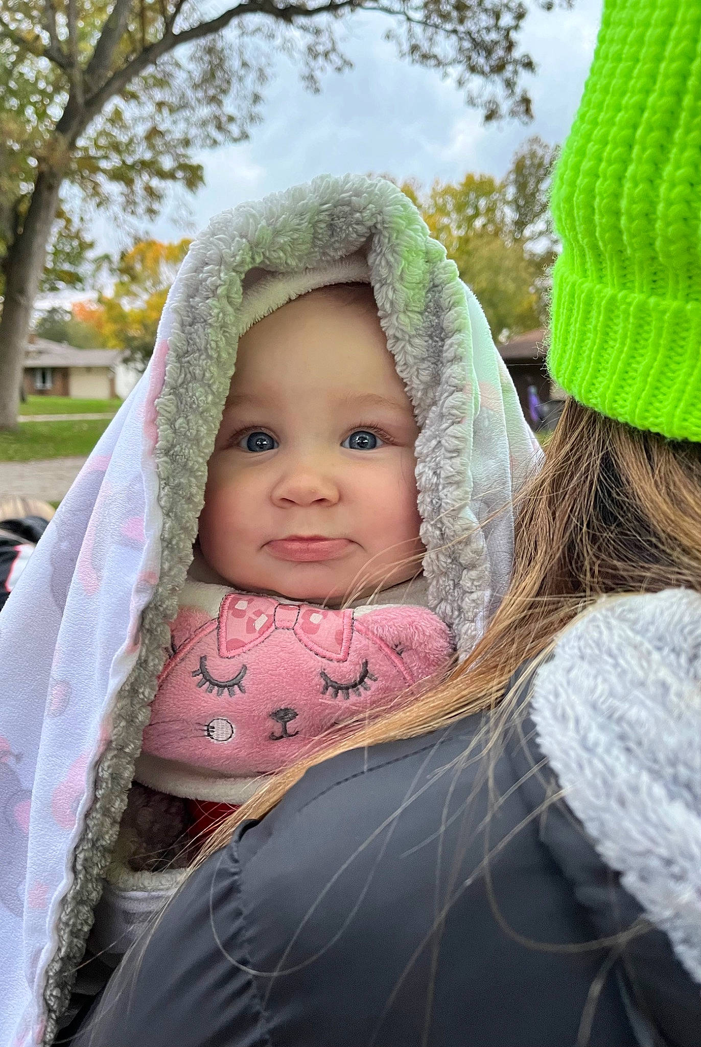 Gracie is registered to the contest to win money with this photo: baby, baby_carriage, cap, child, eye, face, facial_expression, fun, grass, happy, headgear, headwear, human_body, leaf, leisure, people_in_nature, person, plant, skin, toddler