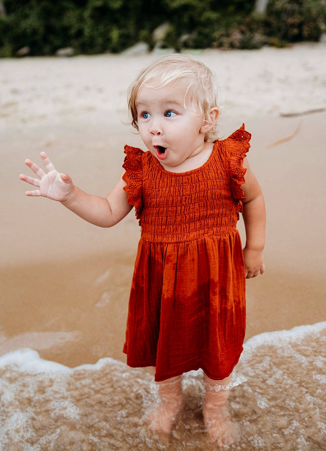 Gracie joined the competition — help win amazing prizes! baby_toddler_clothing, beach, blond, body_of_water, child, finger, fun, gesture, grass, hand, happy, people_in_nature, person, pink, skin, sleeve, standing, summer, surprise, toddler