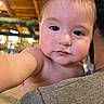 baby, child, face, indoor, person, curious, closeup, selfie, arm, shoulder, skin, head, expression, young, cute, cheeks, lighting, warm, background, wooden_ceiling