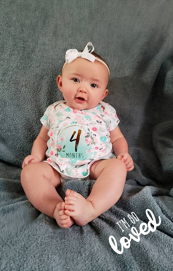 Linda is registered to the contest to win money with this photo: baby, baby_bloomers, baby_products, baby_toddler_clothing, cheek, child, hair_accessory, head, headband, headgear, person, photography, pink, product, sitting, sleeve, toddler