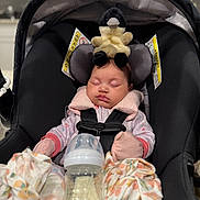 Giavanna joined the competition — help win amazing prizes! baby, blanket, bottle, car_seat, clothing, cute, duck, head_support, indoor, infant, kitchen, milk, mittens, peaceful, plush_toy, portrait, resting, safety_harness, sleeping, soft_lighting