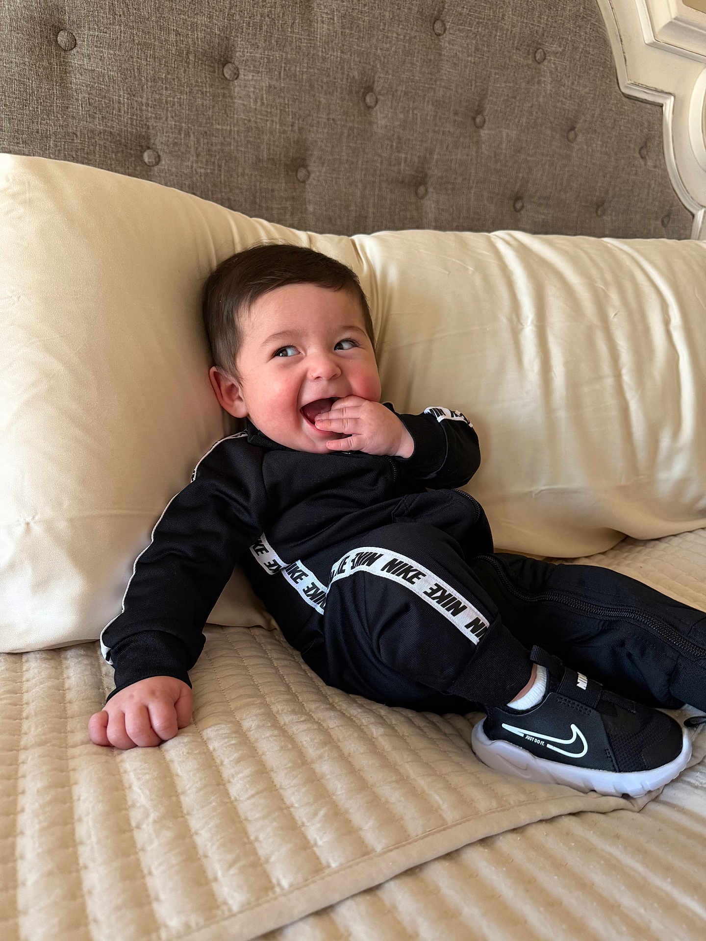 Essex joined the competition — help win amazing prizes! baby, infant, child, smiling, happy, bed, pillow, headboard, blanket, tracksuit, nike, sneakers, shoe, hand, portrait, indoor, cheeky, cute, hair, cheek