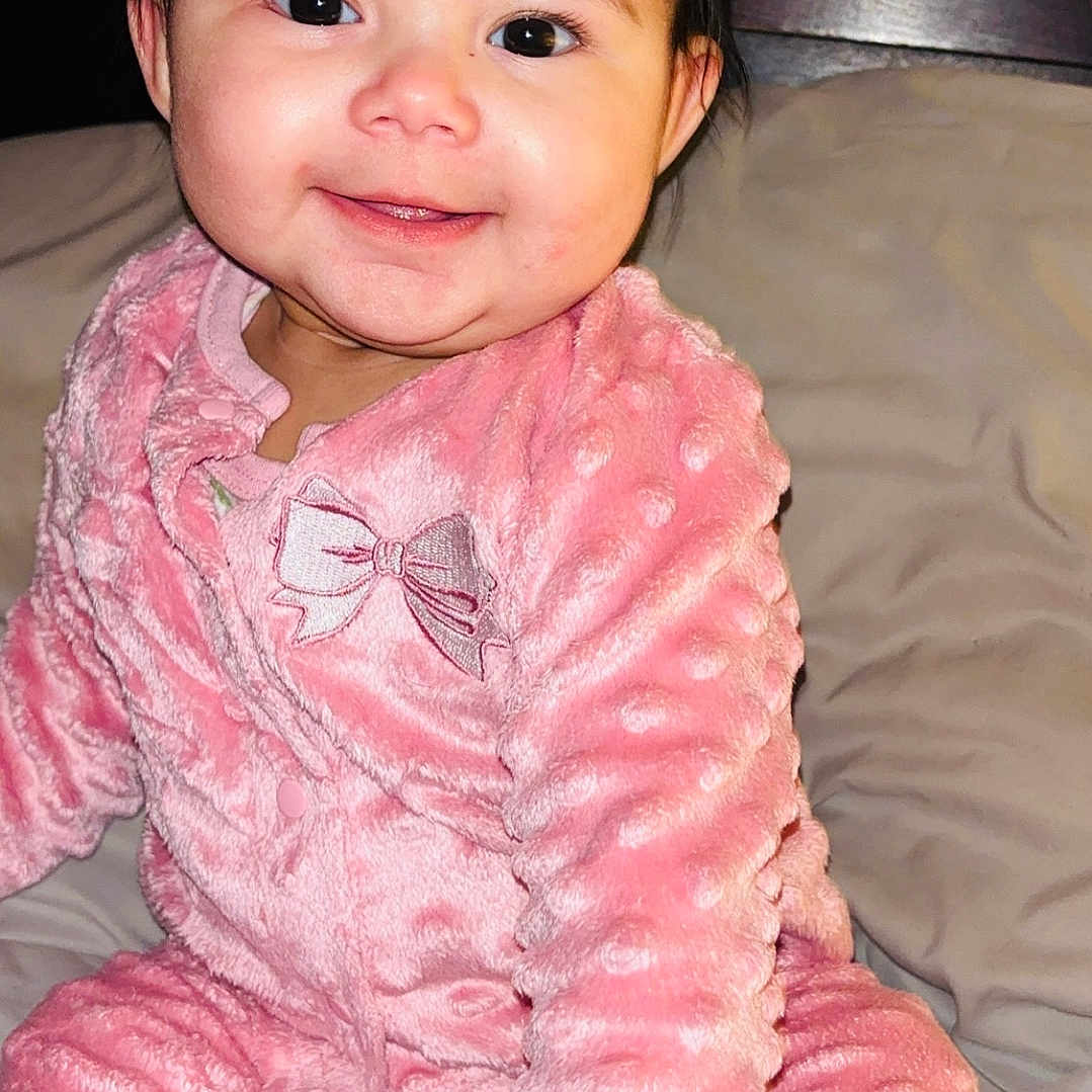 Kamila joined the competition — help win amazing prizes! baby, bed, bedroom, blanket, bodypart, clothing, face, finger, furniture, hand, happy, head, indoors, pajamas, person, photography, portrait, room, sitting, smile