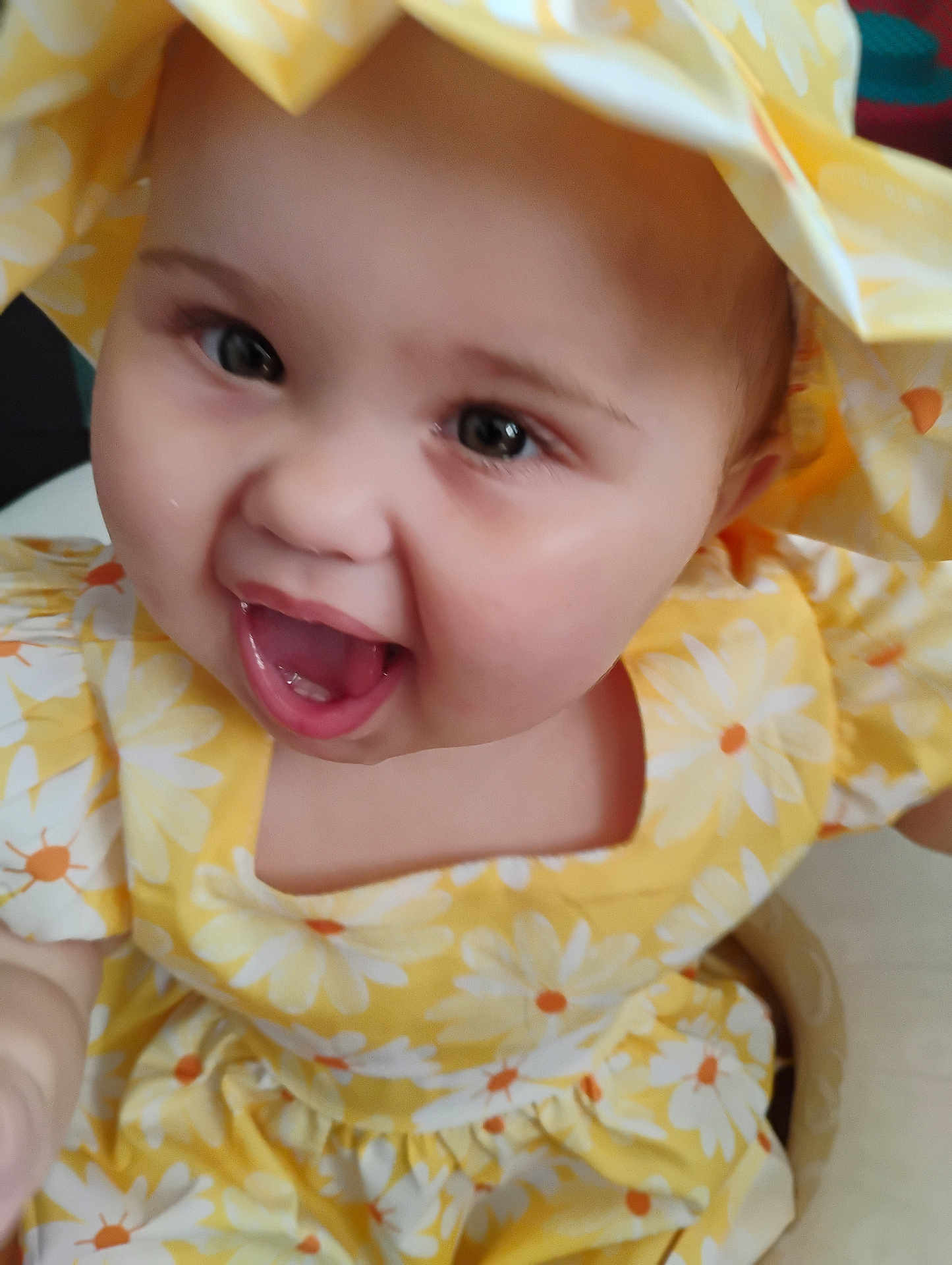 Olivia Jeanmarie joined the competition — help win amazing prizes! baby, child, smiling, yellow_dress, flower_pattern, happy, portrait, cute, face, closeup, infant, young_child, apparel, headwear, joyful, expressive, skin, cheerful, person, indoors