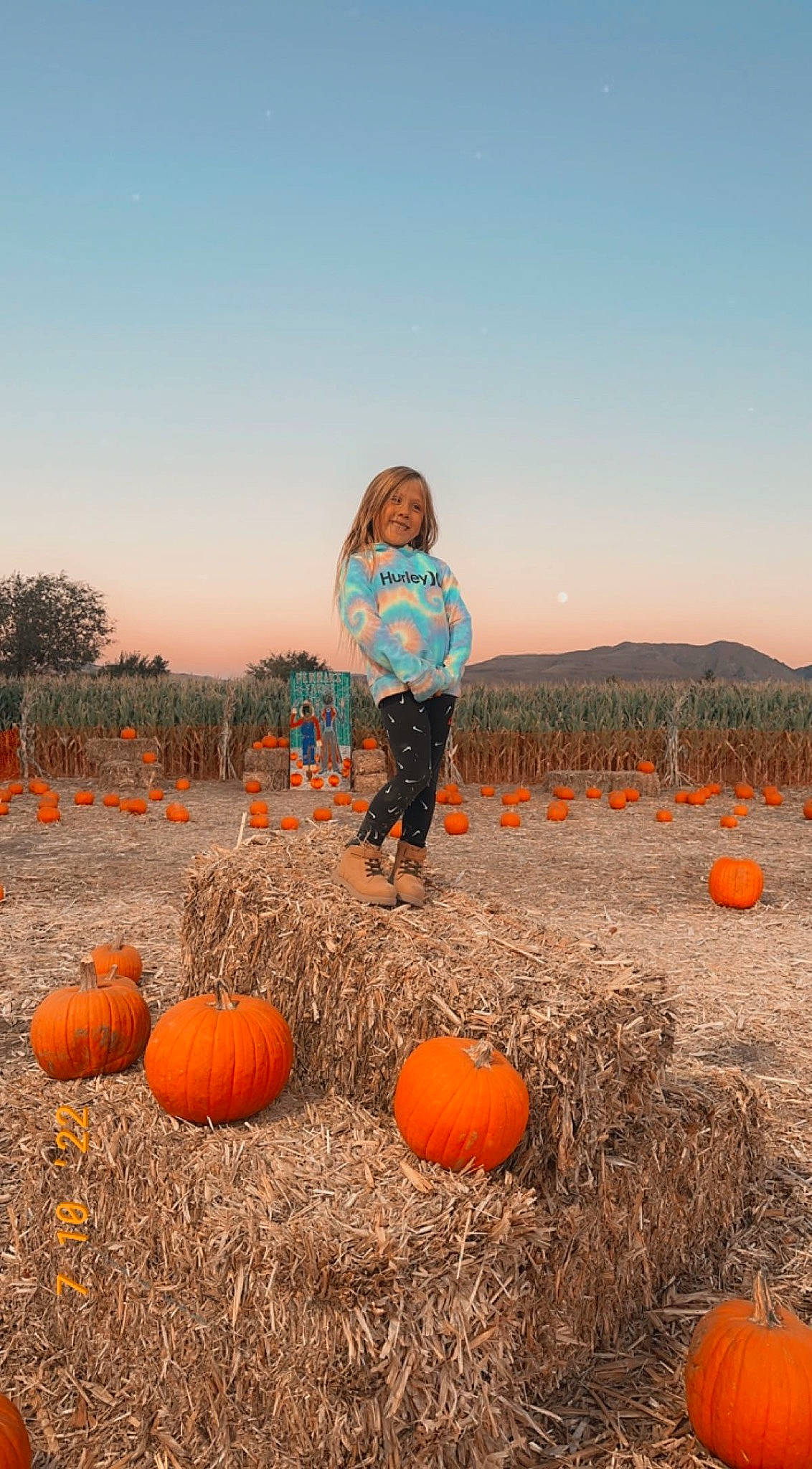 Averie is registered to the contest to win money with this photo: agriculture, calabaza, cucurbita, field, gourd, grass, grassland, happy, joy, landscape, morning, natural_foods, natural_landscape, people_in_nature, person, plant, prairie, pumpkin, sky, squash